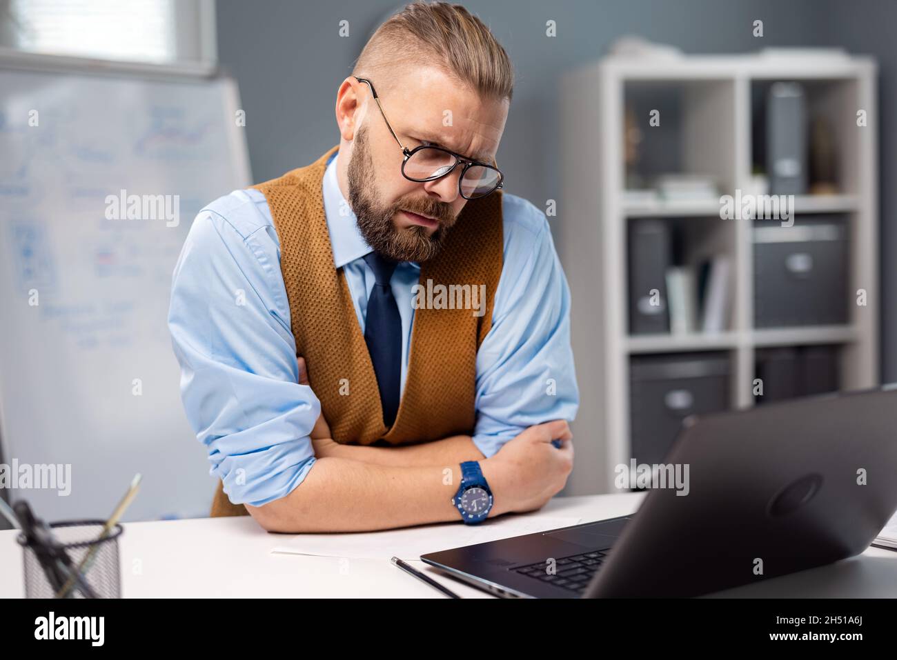 Focused businessman using laptop Stock Photo