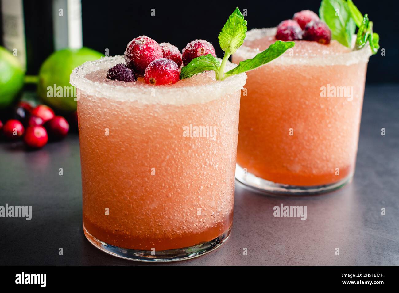 Cranberry Margaritas Garnished with Sugared Cranberries and Mint