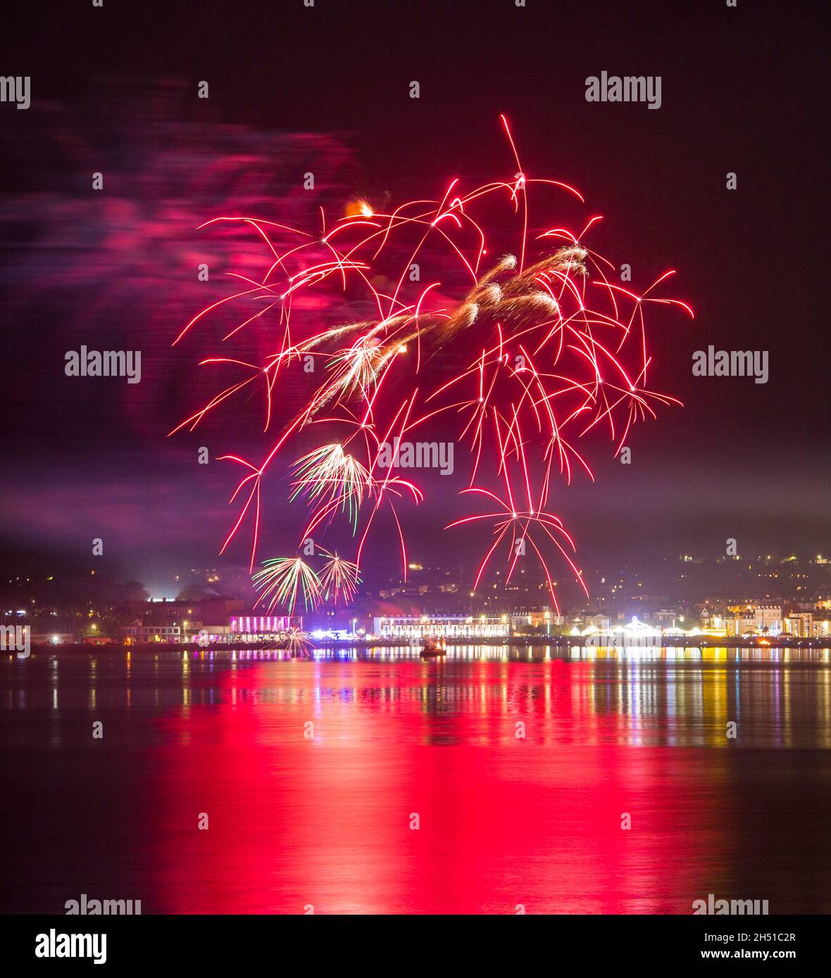 Weymouth, Dorset, UK.  5th November 2021.  Guy Fawkes night fireworks explode over the beach and seafront at Weymouth in Dorset.  Picture Credit: Graham Hunt/Alamy Live News Stock Photo