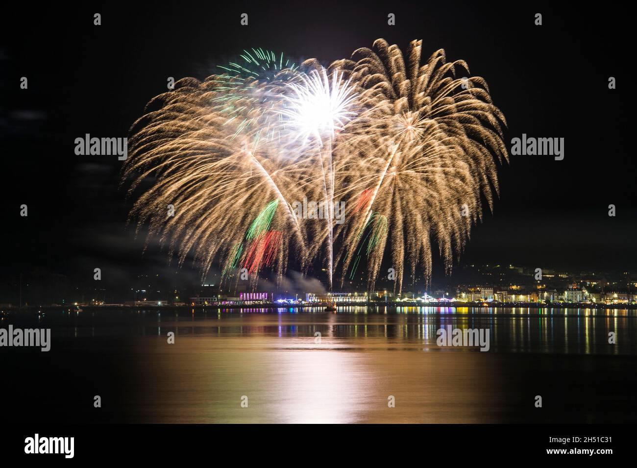 Weymouth, Dorset, UK.  5th November 2021.  Guy Fawkes night fireworks explode over the beach and seafront at Weymouth in Dorset.  Picture Credit: Graham Hunt/Alamy Live News Stock Photo