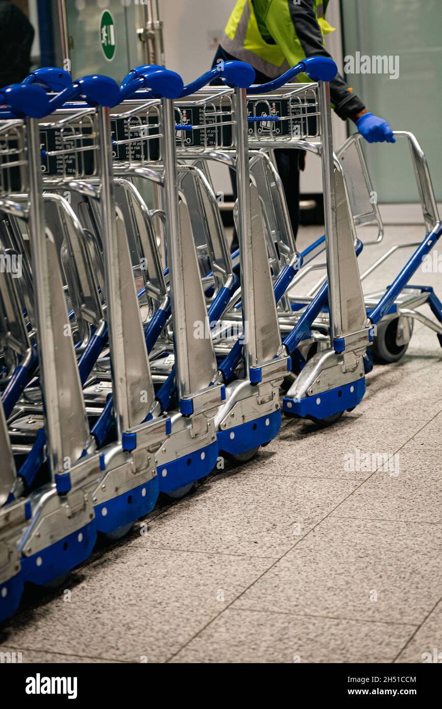 Row of airport luggage carts in airport terminal Stock Photo Alamy