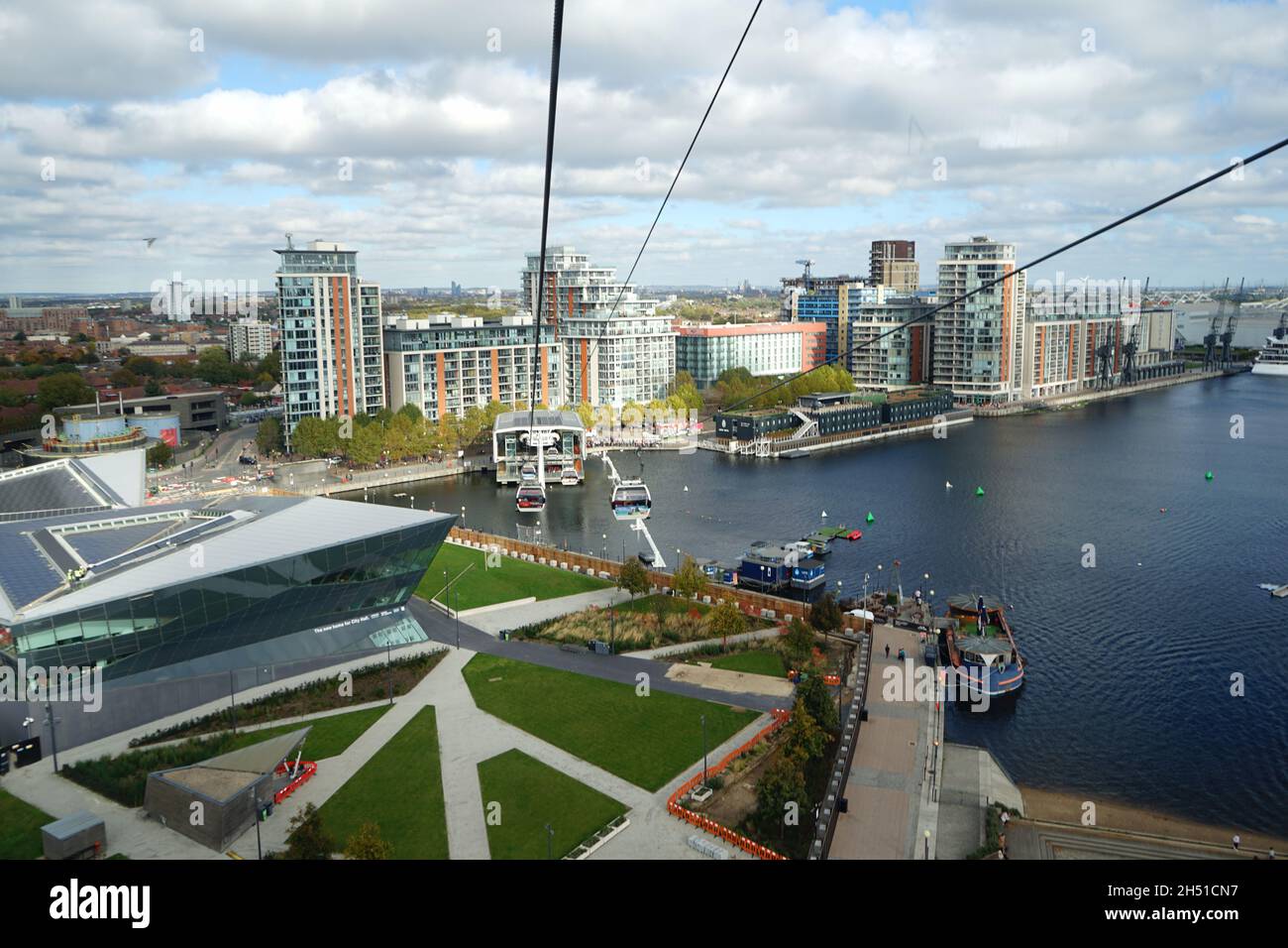 An aerial view from the Emirates Cable Cars approaching the Royal Dock over London River Thames in he U.K Stock Photo