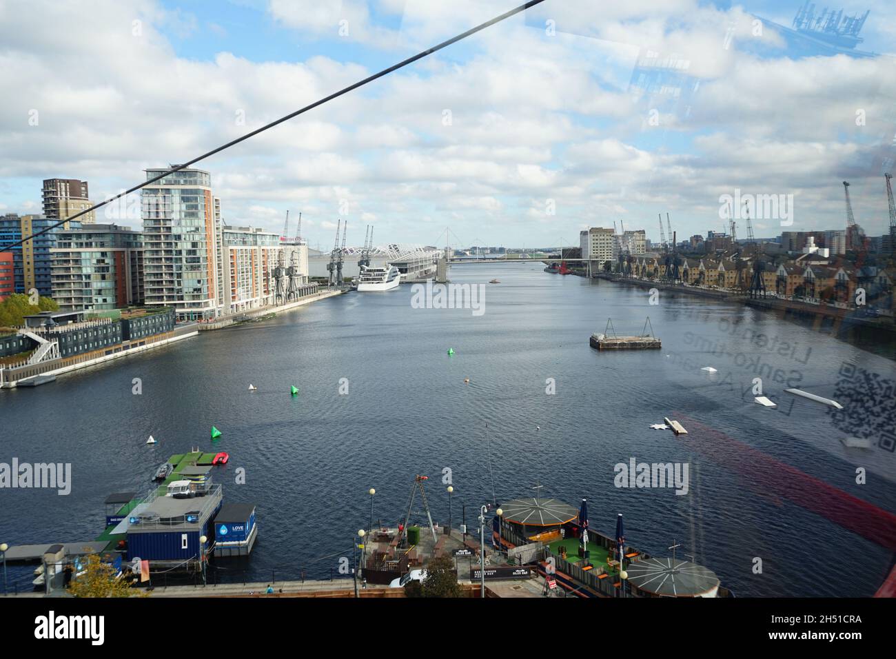 A view of the Thames River from the Emirates Cable car zip lining over the Thames from the Greenwich Peninsula to the Excel Centre at the Royal Docks Stock Photo