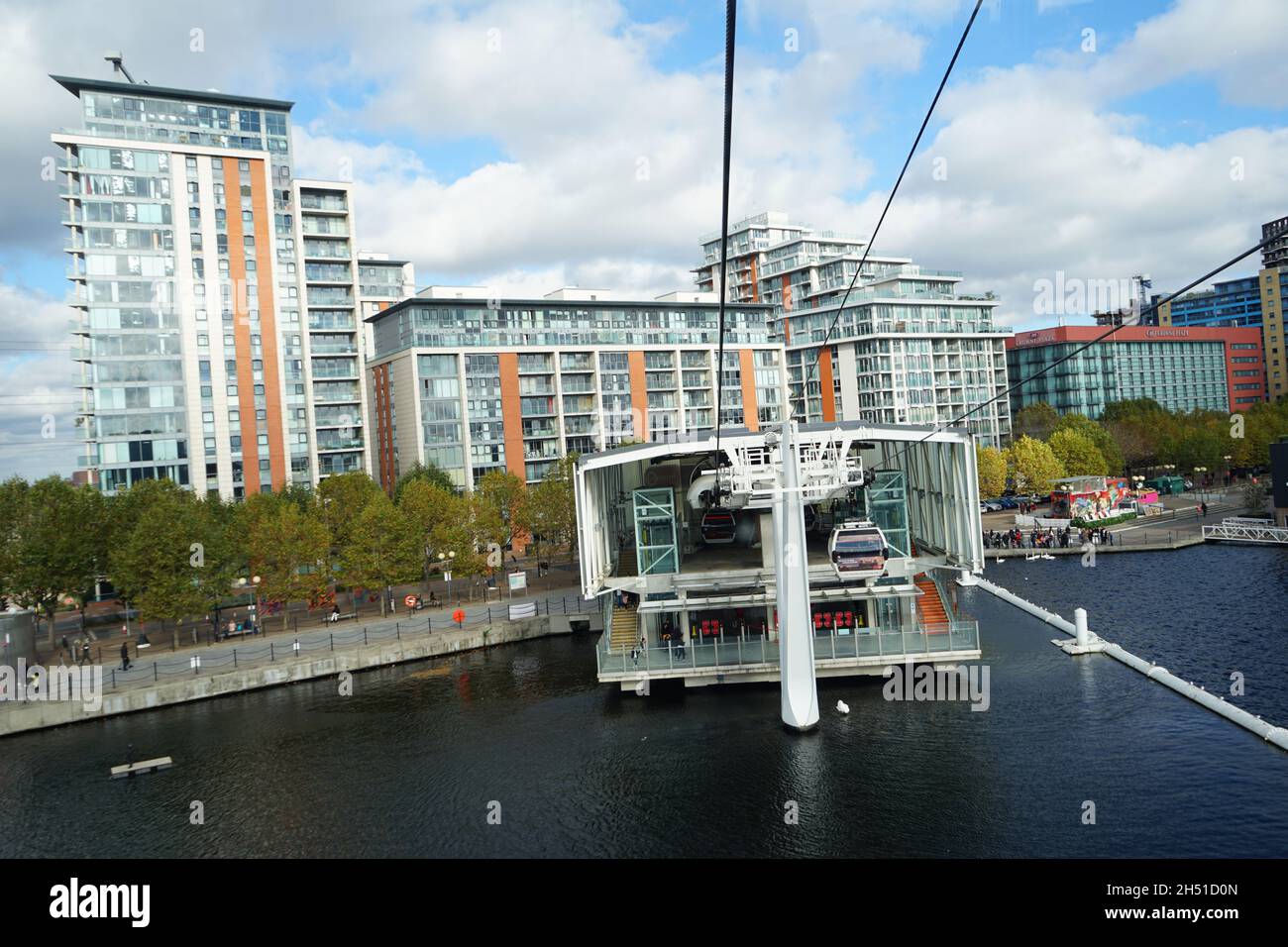 An aerial view from the Emirates Cable Cars approaching the Royal Dock over London River Thames in he U.K Stock Photo