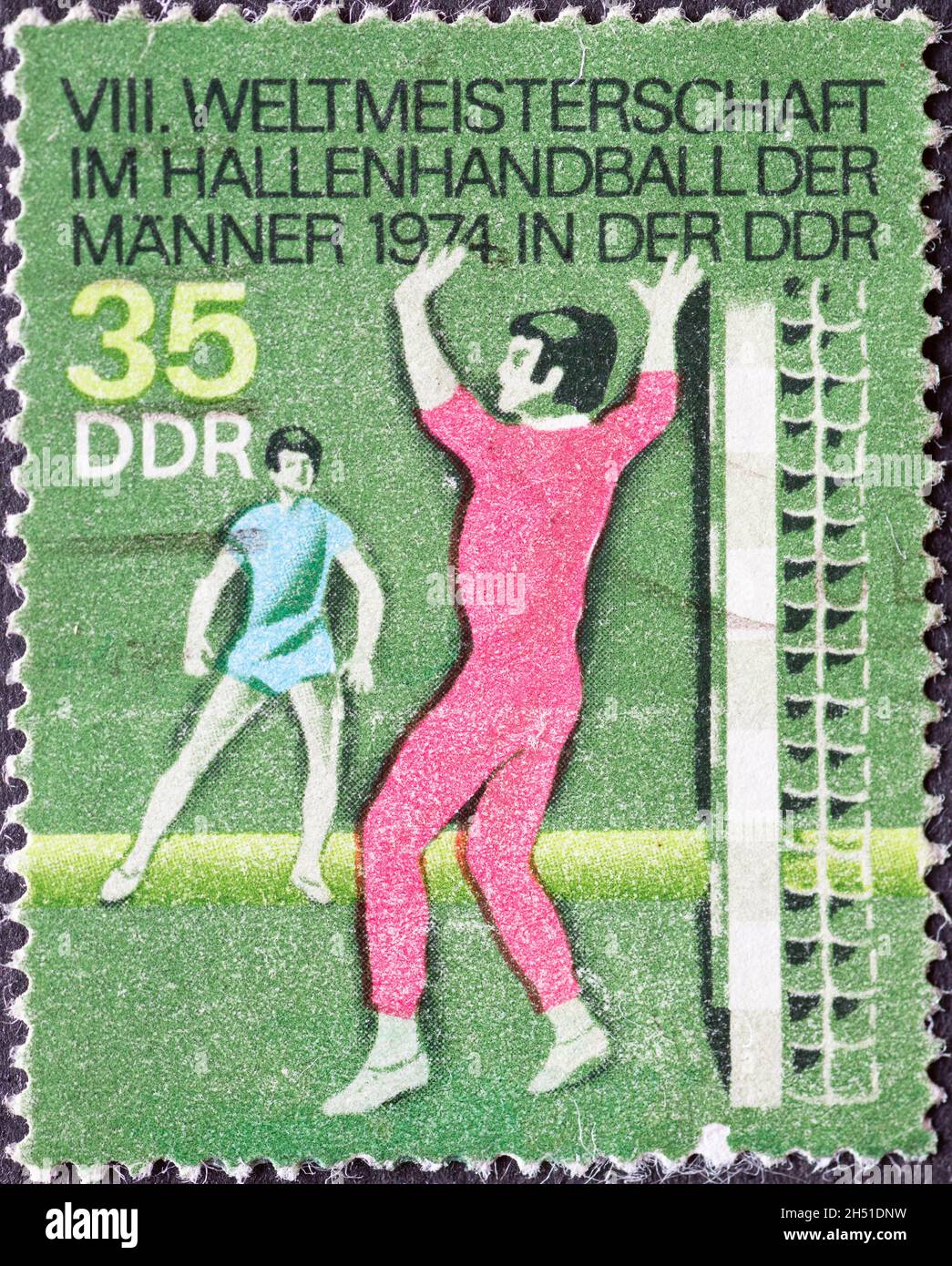 GERMANY, DDR - CIRCA 1974 : a postage stamp from Germany, GDR showing 1974 Men's Indoor Handball World Championship, goalkeeper Stock Photo