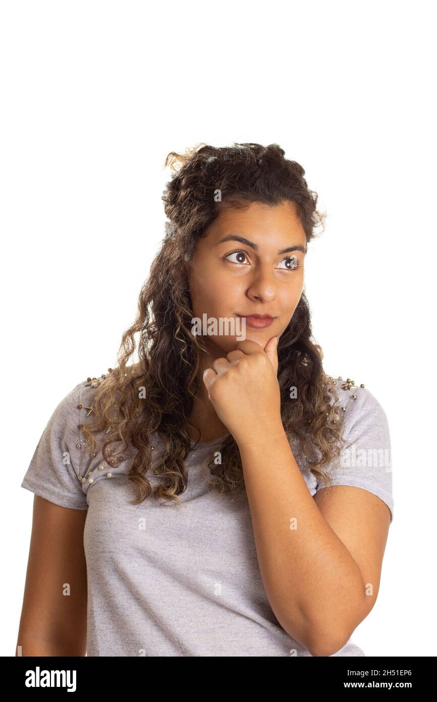 Black curly hair girl looking to the side and thinking dreaming unsure of  the future. Isolated on white background Stock Photo - Alamy