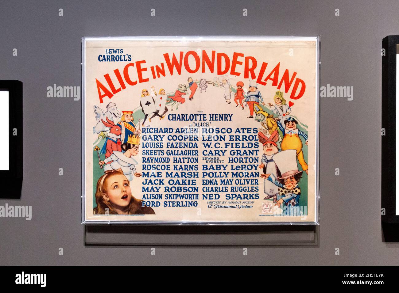 Poster for Alice in Wonderland 1933 film, 'Alice: Curiouser and Curiouser' 2021 exhibition at the V&A, London, UK Stock Photo