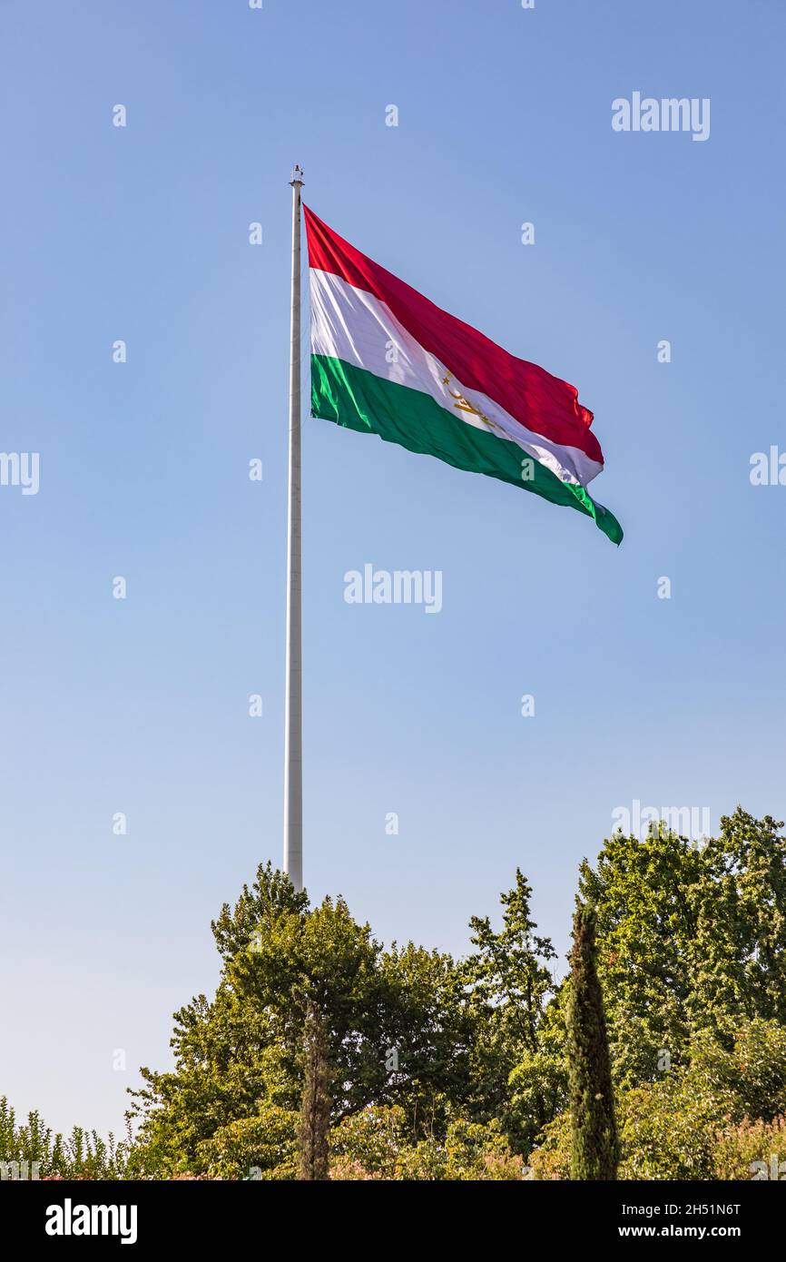 Dushanbe, Tajikistan. Tajik flag flying in Rudaki Park. Stock Photo