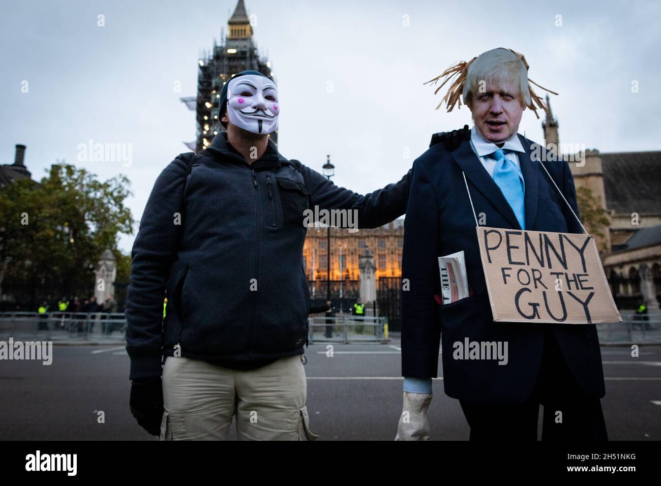 London, UK. 05th Nov, 2021. A person dressed up with an Anonymous mask on stands in front of the Houses of Parliament for the annual Million Mask march through the city. The Anonymous movement stands in solidarity for a society which is marginalised by the political elite and associated corporations. Credit: Andy Barton/Alamy Live News Stock Photo