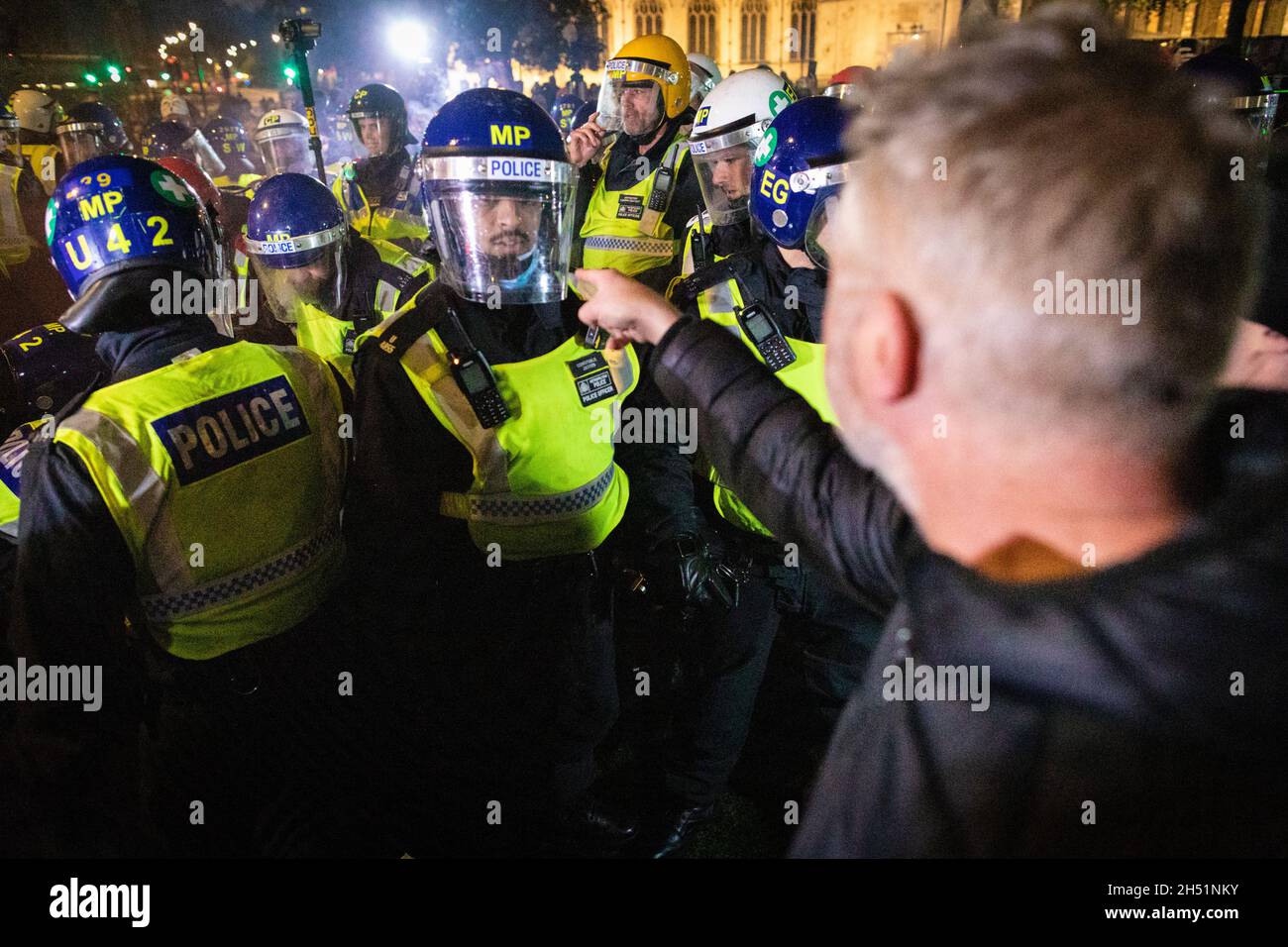 London, UK. 05th Nov, 2021. Police clash with protesters as they move in outside the Houses of Parliament during the annual Million Mask march through the city. The Anonymous movement stands in solidarity for a society which is marginalised by the political elite and associated corporations. Credit: Andy Barton/Alamy Live News Stock Photo