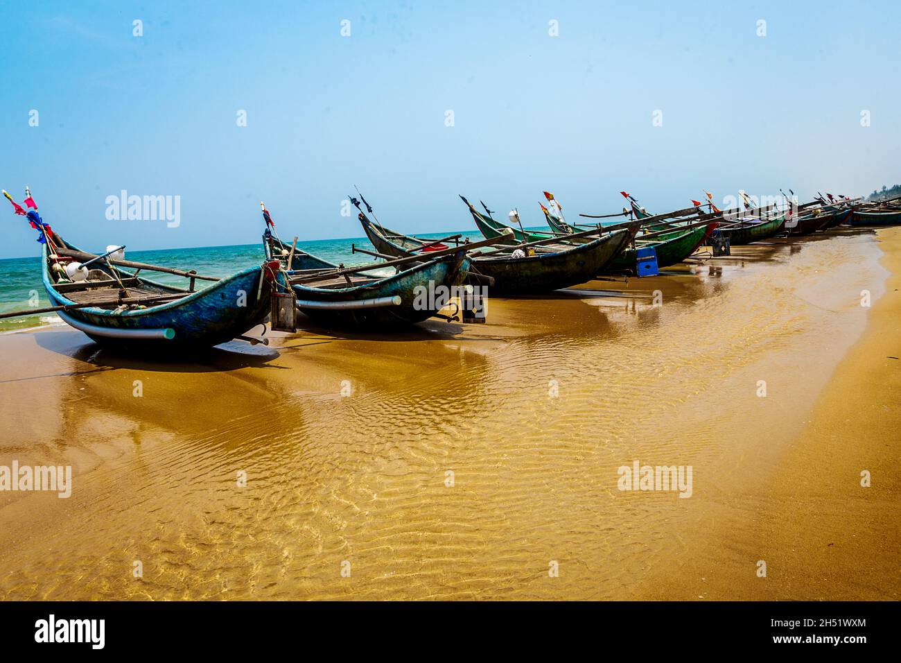 Fishing boats pulled up on the beach at Tam Ky, Tam Thanh. Stock Photo
