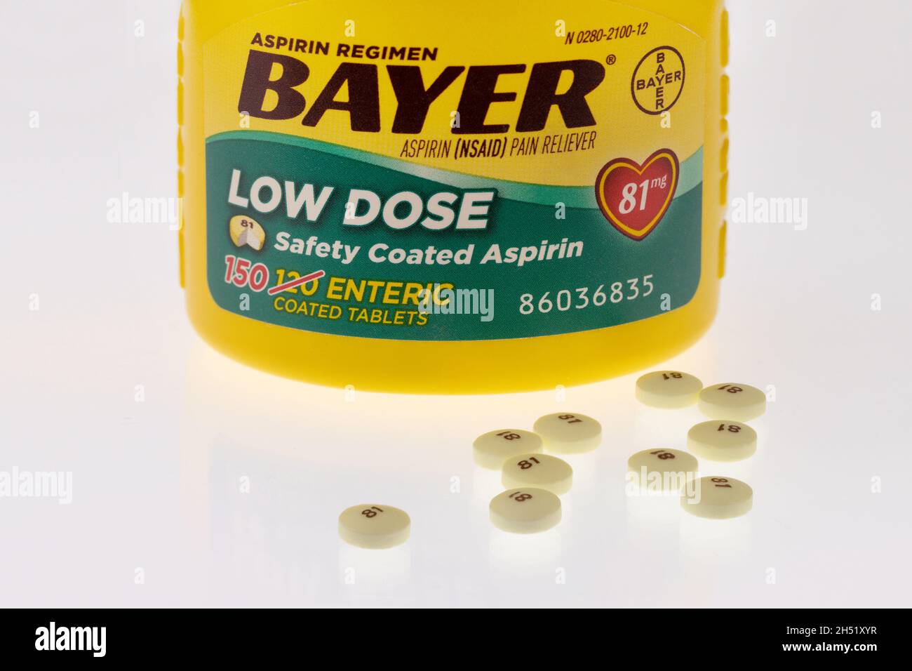 illustrative editorial of Bayer lowdose aspirin bottle and pills on a