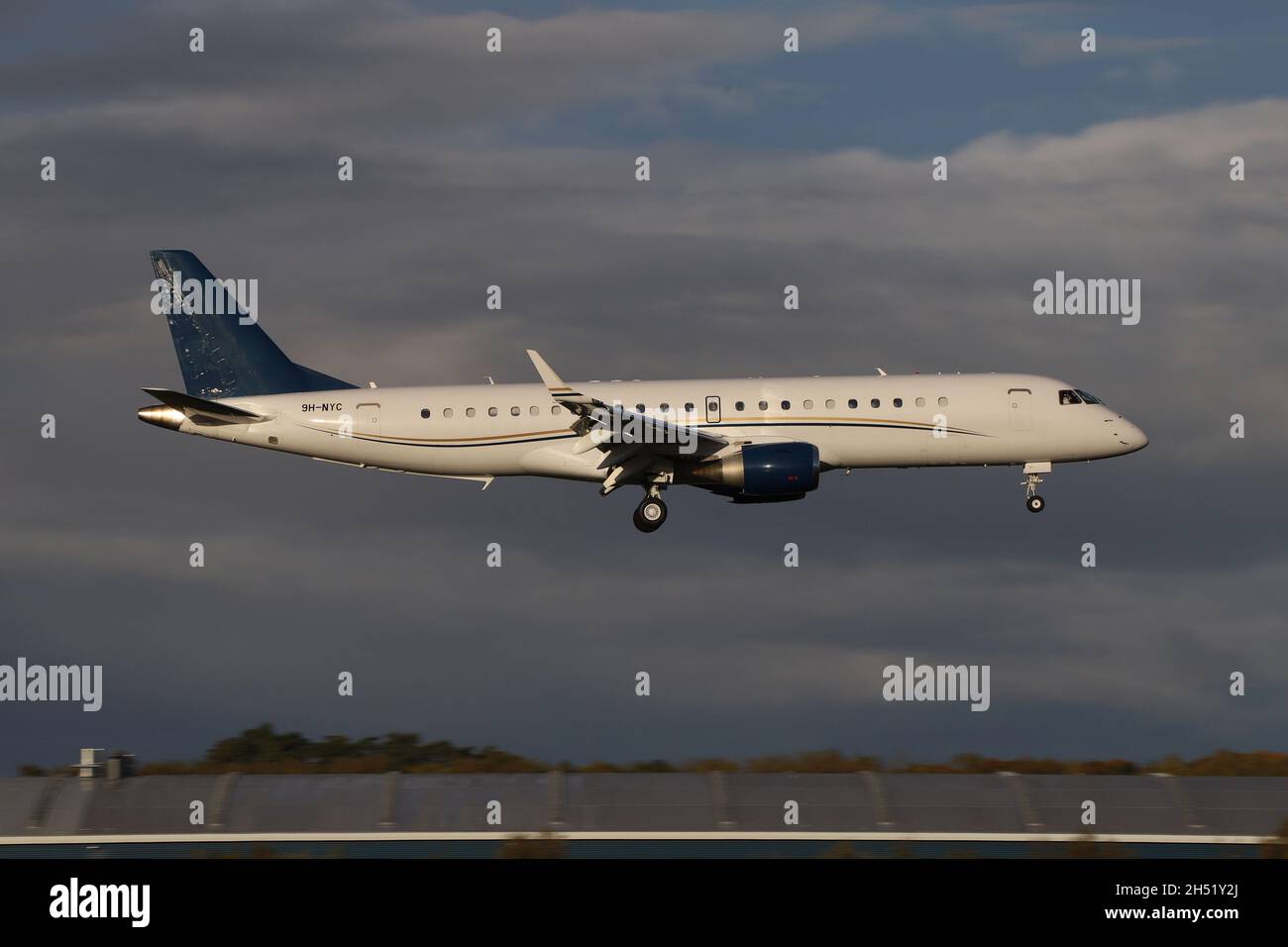 9H-NYC, an Embraer Lineage 1000 operated by AirX Charter, on final approach to Prestwick Airport in Ayrshire, Scotland. The aircraft was in Scotland to bring Kyrgyzstan delegates to the COP26 climate change conference being held in nearby Glasgow. Stock Photo