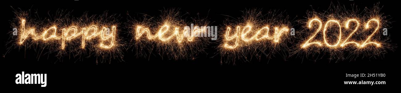 happy new year 2022 greeting. golden bright modern sparkler number and letter isolated on black. silvester eve celebration background Stock Photo