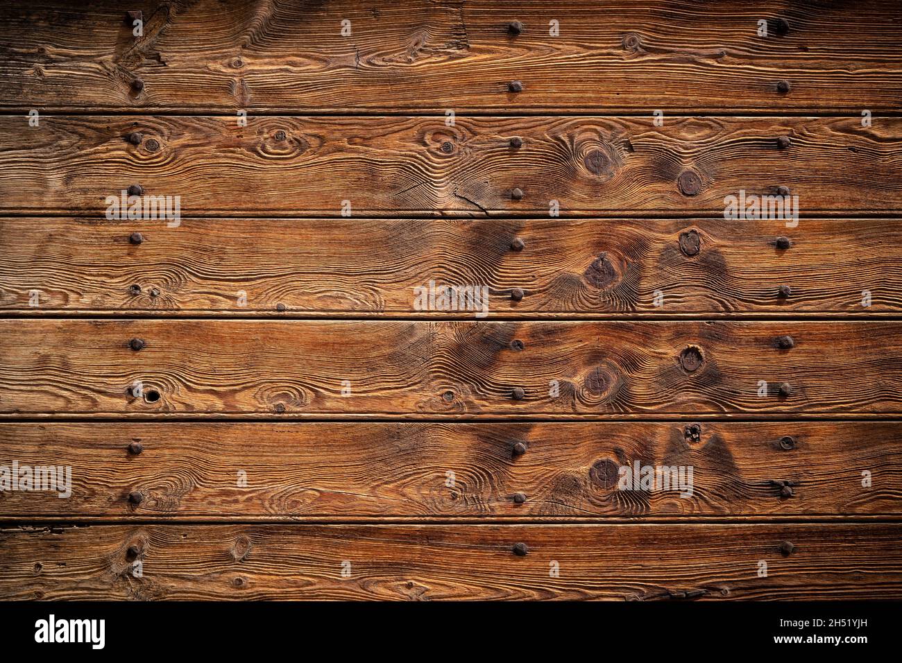 old weathered rustic brown dark oak wood texture with  retro design pattern and copy space background Stock Photo