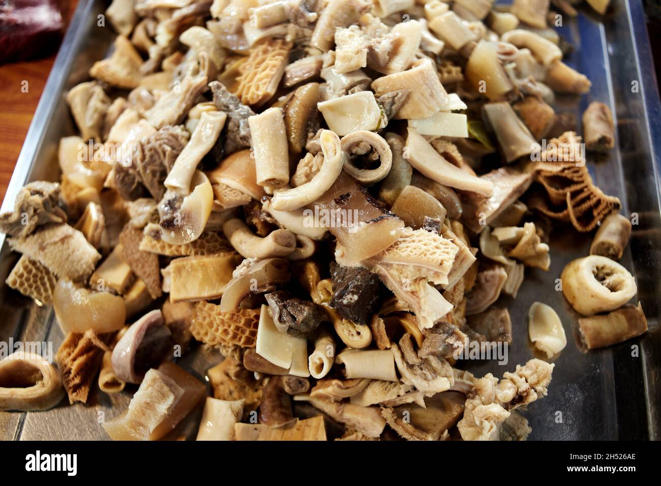 Mixed beef offal boiled on tray for sale Stock Photo
