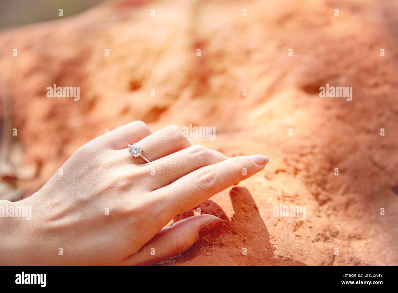 Close-up of Elegant Diamond Ring on Blurred Background. Luxury Diamonds Jewellery Accessory. I Love You Darling Concept. In Selective Focus Stock Photo