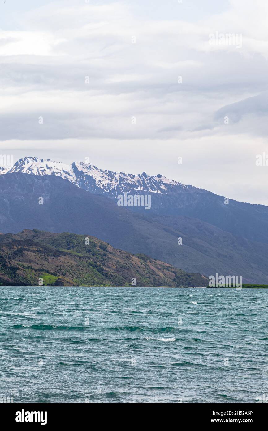 Landscapes of Wanaka lake. Snow, stones and water. South Island, New Zealand Stock Photo