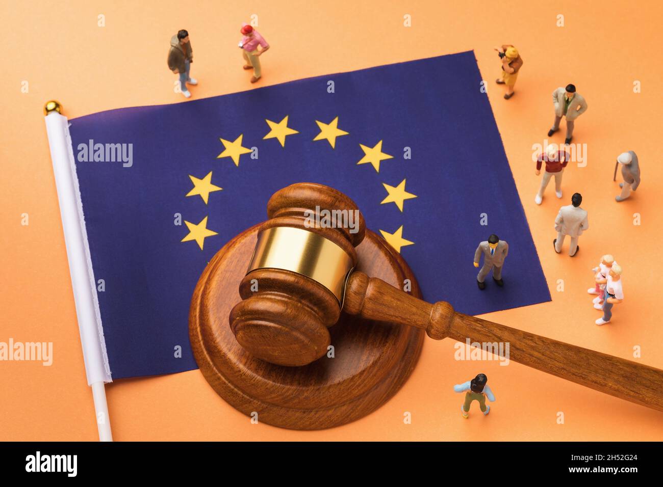 Judge gavel, flag and plastic toy men, the concept of litigation in European society Stock Photo