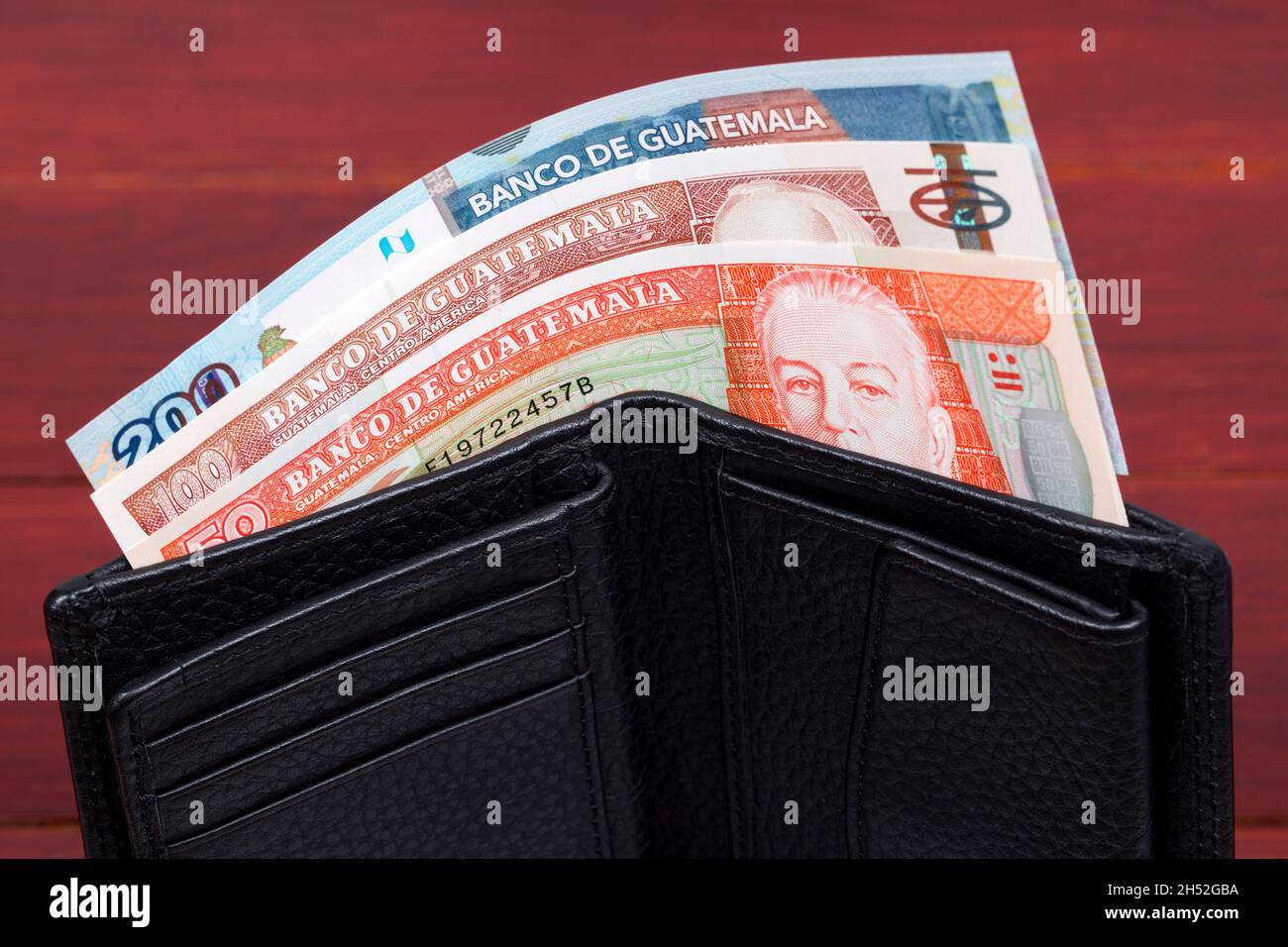 Guatemalan money - quetzal in the black wallet Stock Photo
