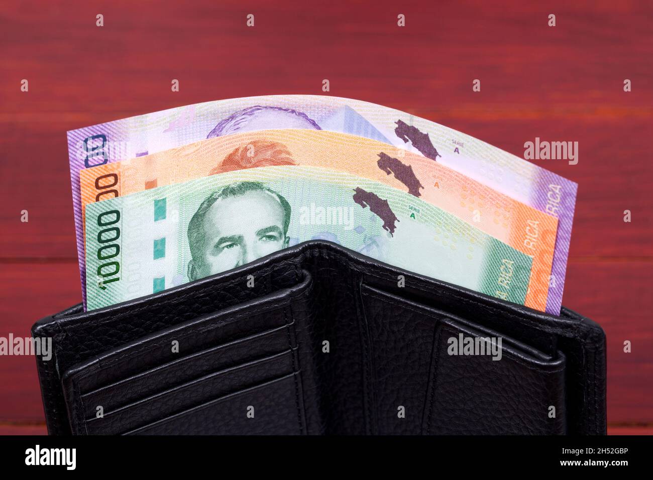 Costa Rican money colon in the black wallet Stock Photo Alamy