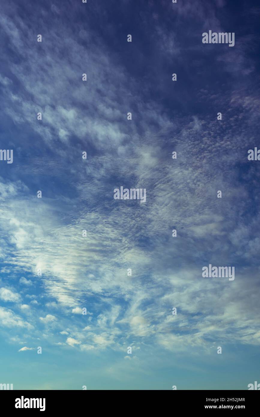 Clouds against a blue sky Stock Photo - Alamy