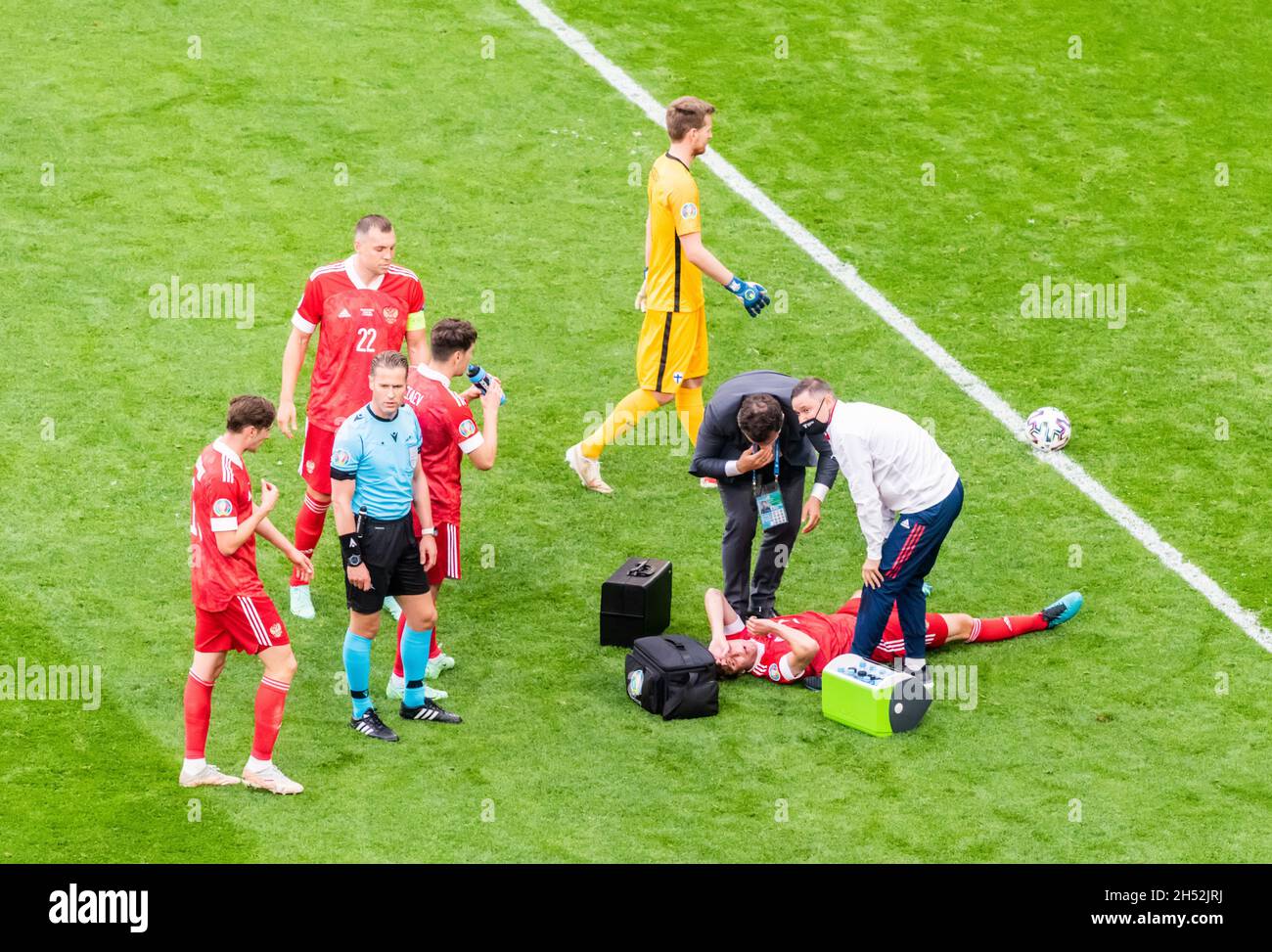 Saint Petersburg, Russia – June 16, 2021. Russia national football team doctors providing medical aid to Mario Fernandes, who just suffered an injury, Stock Photo