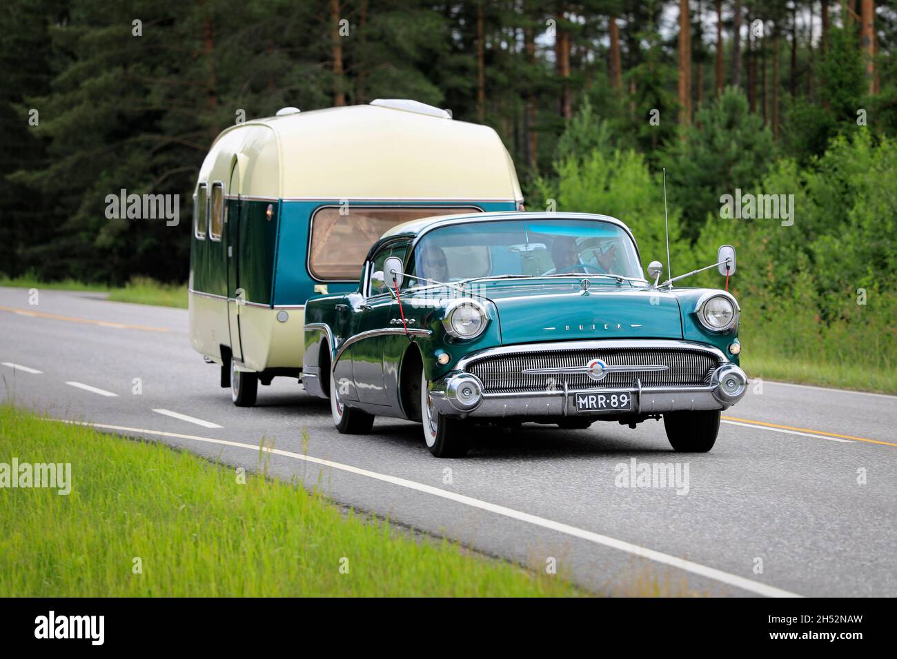 Green 1957 Buick Special with Matching Caravan Stock Photo