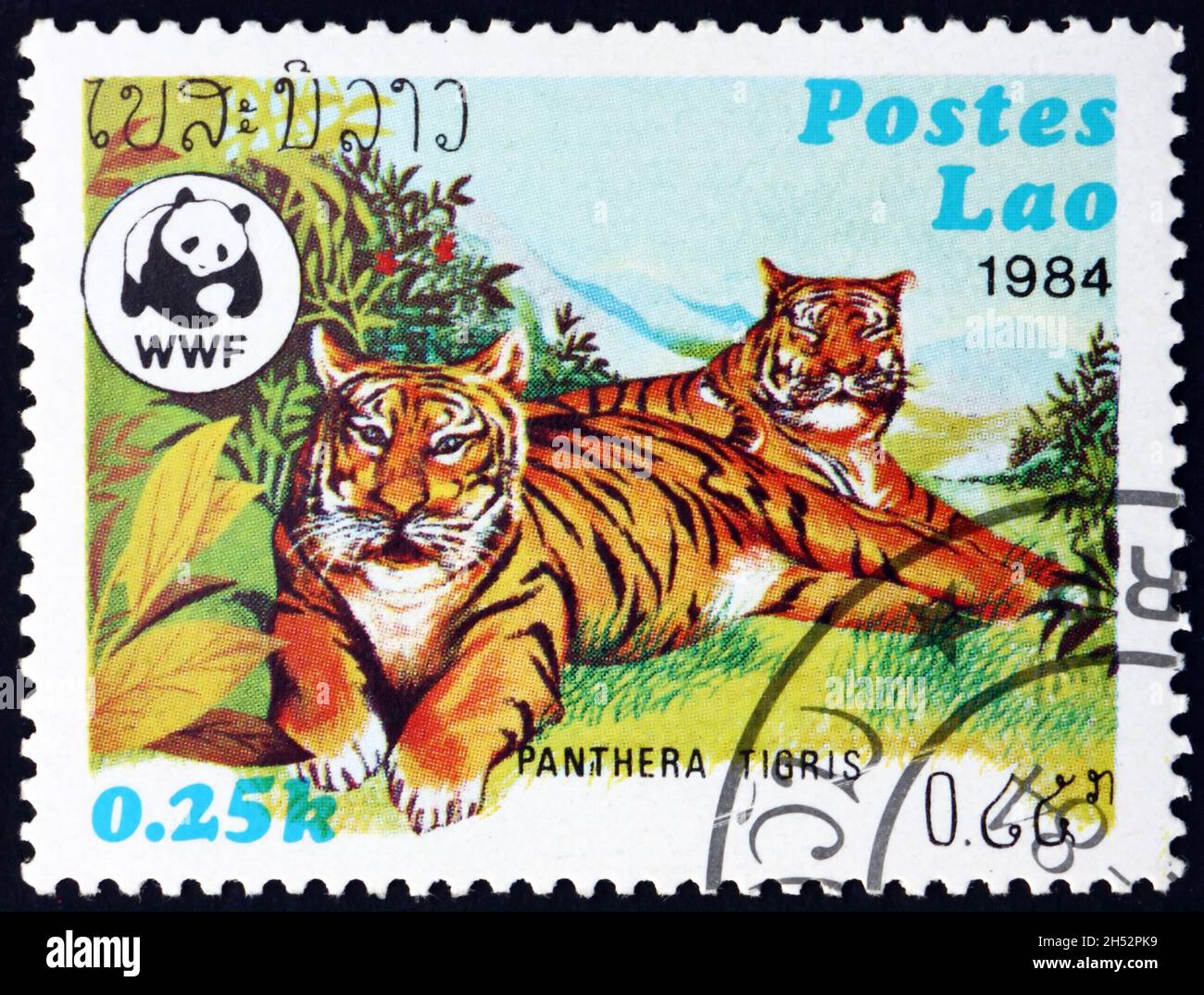 LAOS - CIRCA 1984: a stamp printed in Laos shows tiger, panthera tigris ...