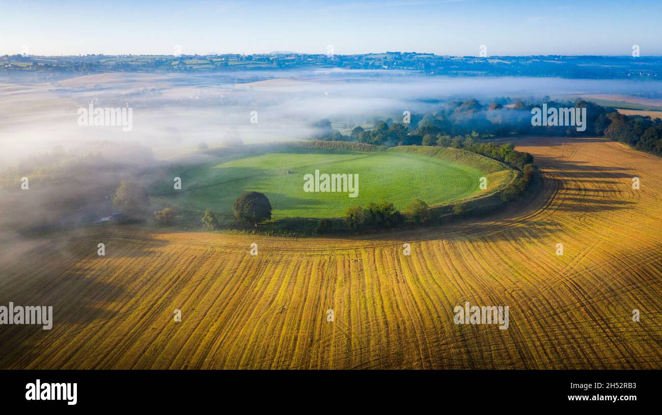 A September Mist hangs over the 4700 year old Henge Monument the Giamt's Ring on the outskirts of Belfast in Northern Ireland Stock Photo