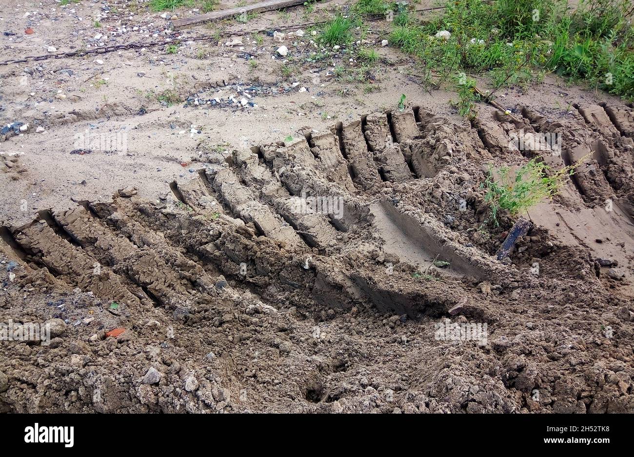 Construction site, road repair.On clay soil, strips from the excavator bucket Stock Photo