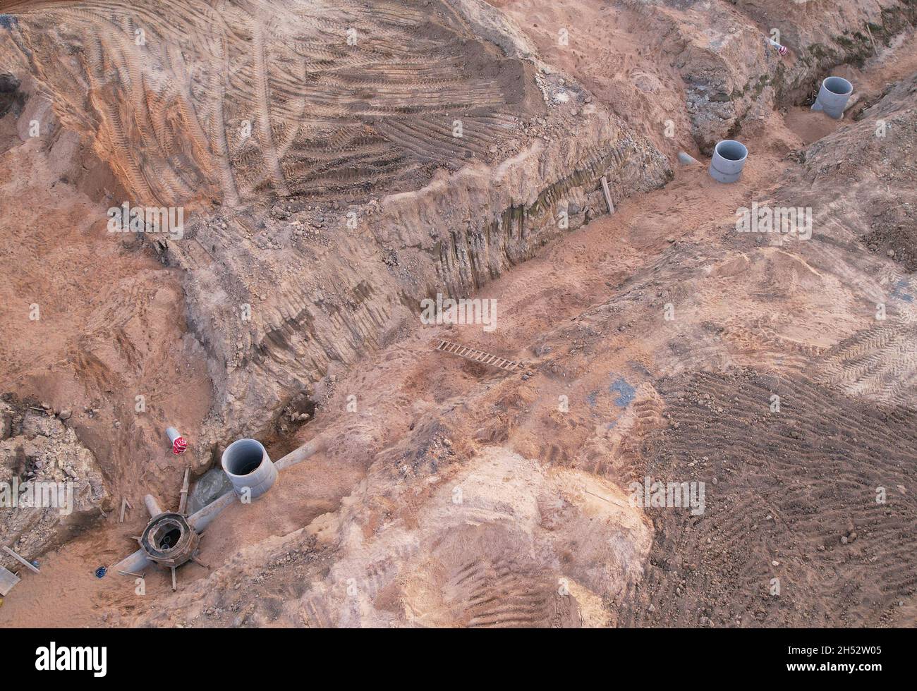 Laying of underground storm sewer pipes and sewerage wells ...