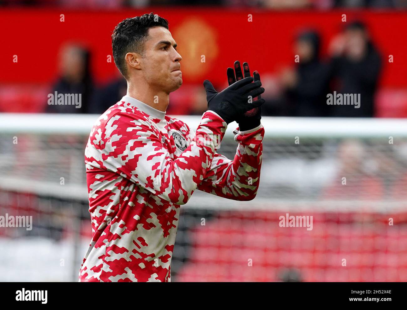 Manchester United s Cristiano Ronaldo warms up ahead of the