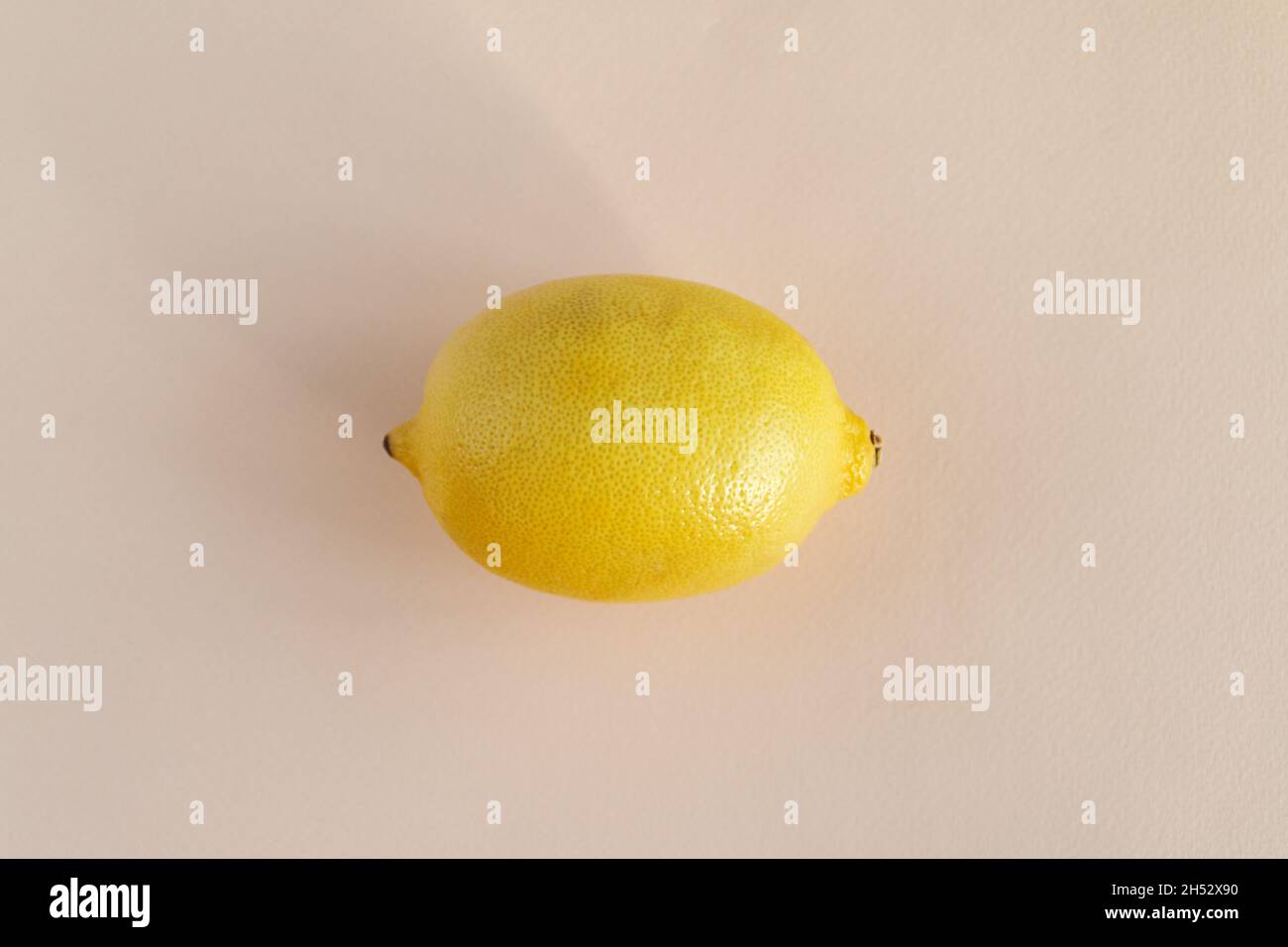 lemon on pink background, flat lay view Stock Photo