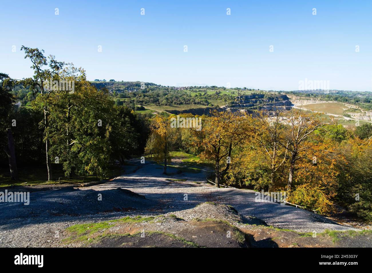 A cloudless autumn day on the steep slopes of Black Rocks and across the Derbyshire countryside. Stock Photo