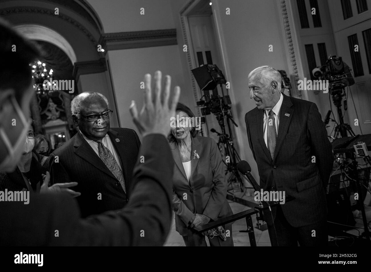 Speaker of the United States House of Representatives Nancy Pelosi (Democrat of California), center, is joined by United States House Majority Whip James Clyburn (Democrat of South Carolina), left, and United States House Majority Leader Steny Hoyer (Democrat of Maryland), right, to offer remarks to reporters as the House of Representatives prepares to vote on the Build Back Better and bipartisan Infrastructure bills at the US Capitol in Washington, DC, Friday, November 5, 2021. Credit: Rod Lamkey/CNP Stock Photo