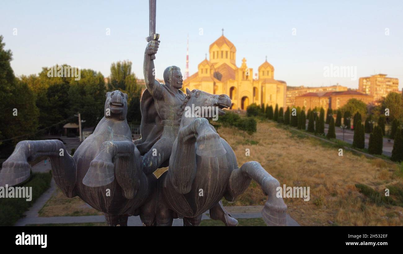 Stone Statue of Armenian national hero Andranik Pasha in front of the biggest Apostolic Church in downtown Yerevan, Armenia Stock Photo