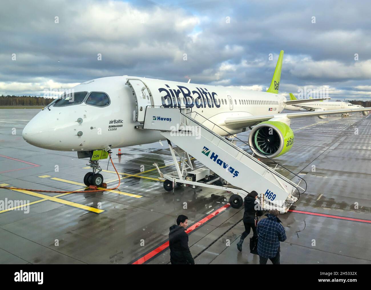 Riga, Latvia - October 28, 2018: AirBaltic Aircraft preparation for departure in the Riga International Airport. Stock Photo