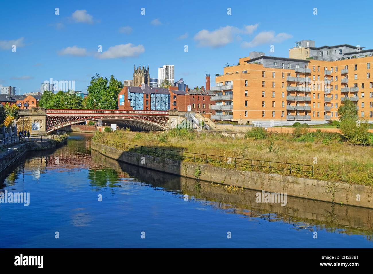 UK, West Yorkshire, Leeds, Crown Point Bridge over the River Aire, with Apartments, Leeds Minster and Altus Building dominating the skyline. Stock Photo