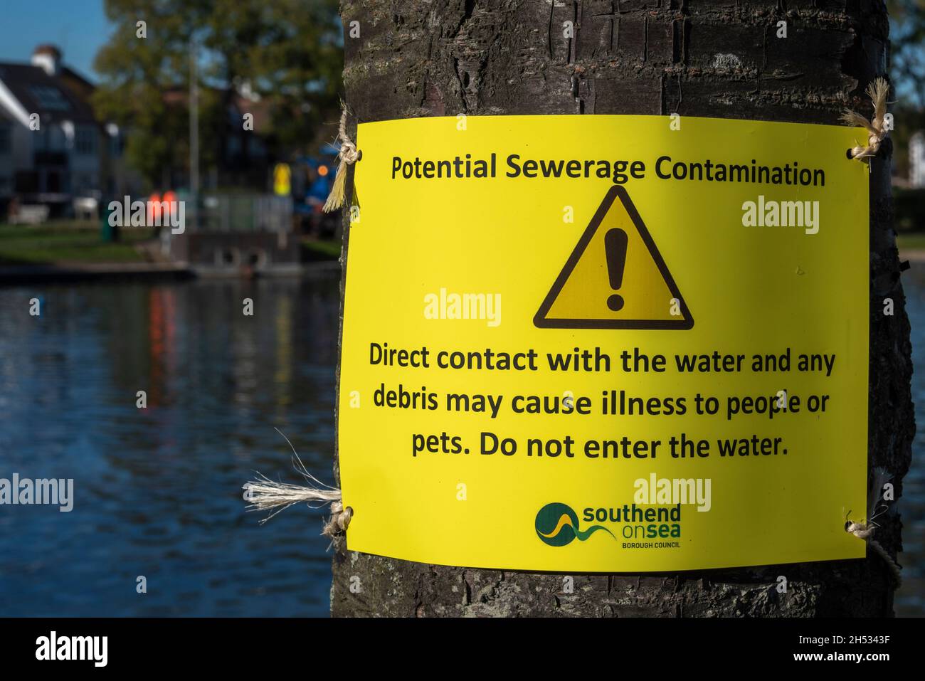 Warning signs around Southchurch Park Lake warning visitors that direct