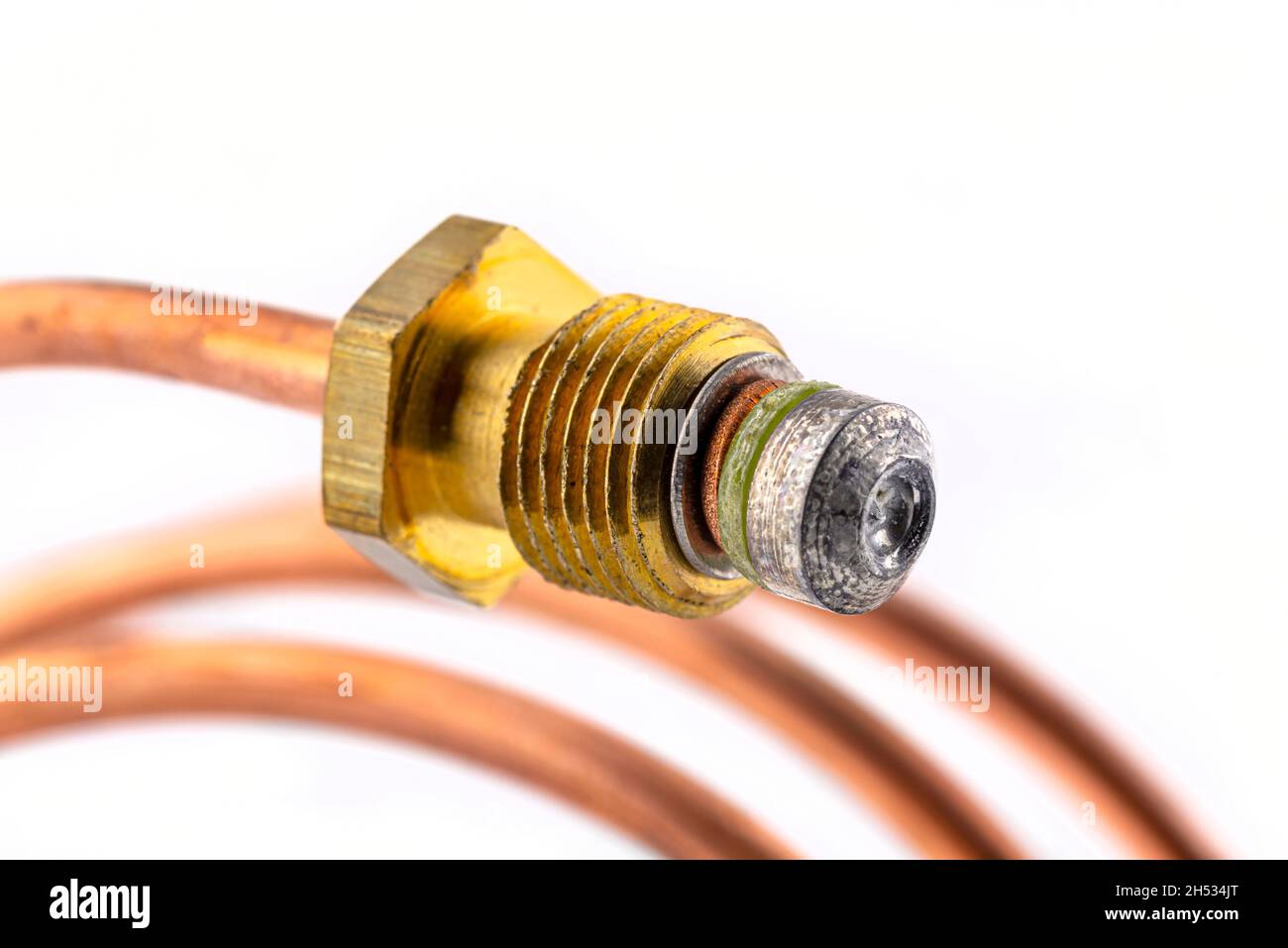 Macro photo of a spiral shaped temperature probe thread, isolated on a white background. Stock Photo