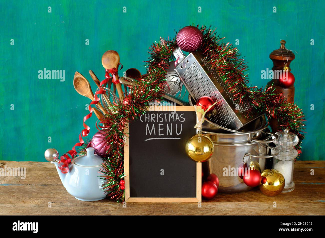 Blackboard with christmas menu and kitchen utensils, free copy space Stock Photo