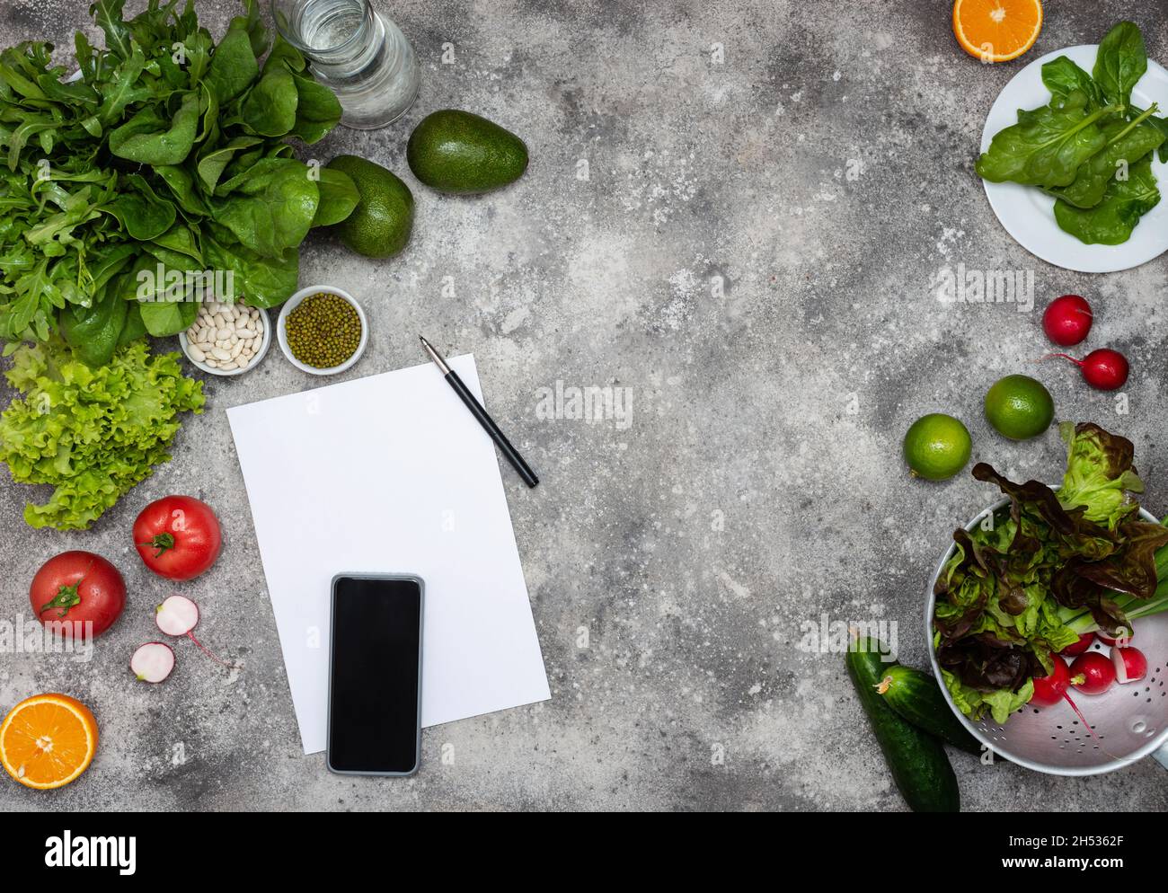 Open Notebook and Fresh Vegetables Background diet Stock Photo