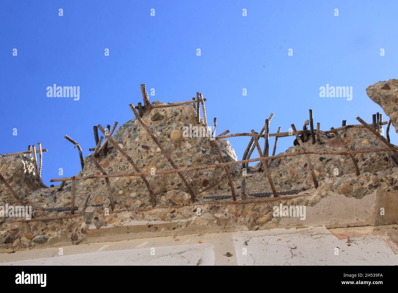 Demolition edge on a roof with steel and concrete Stock Photo