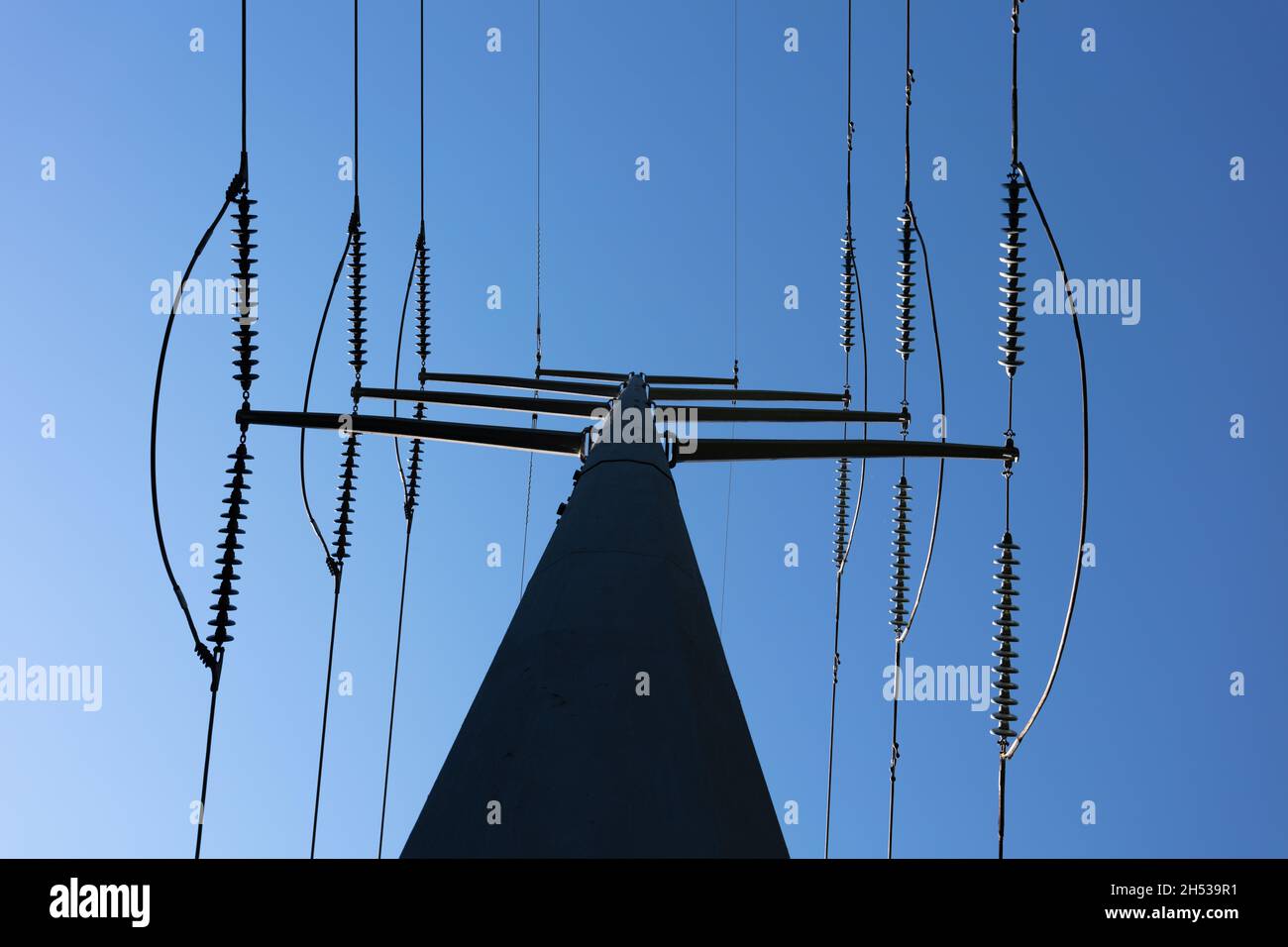 Low angle shot of transmission towers under the daylight sky Stock ...