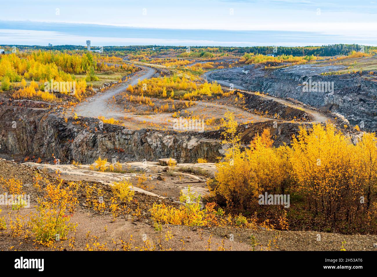 The Vale Canada nickel open pit mine site with fall foliage color in