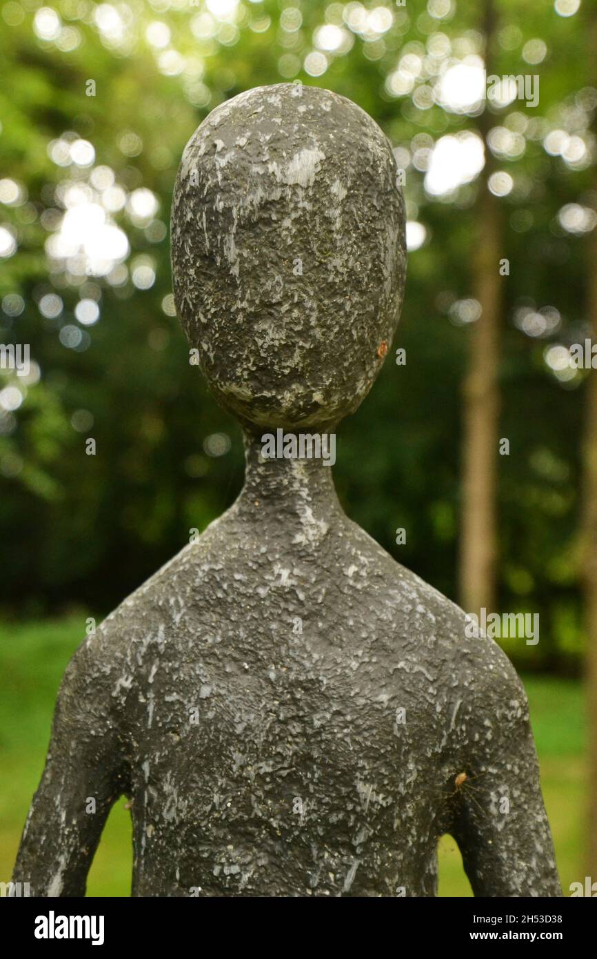 Humanesque Statue in the grounds of Clare Priory, Suffolk UK labelled 'ELECTED Silence Sing to me Gerard Manley Hopkins' (It's a line from his poetry) Stock Photo