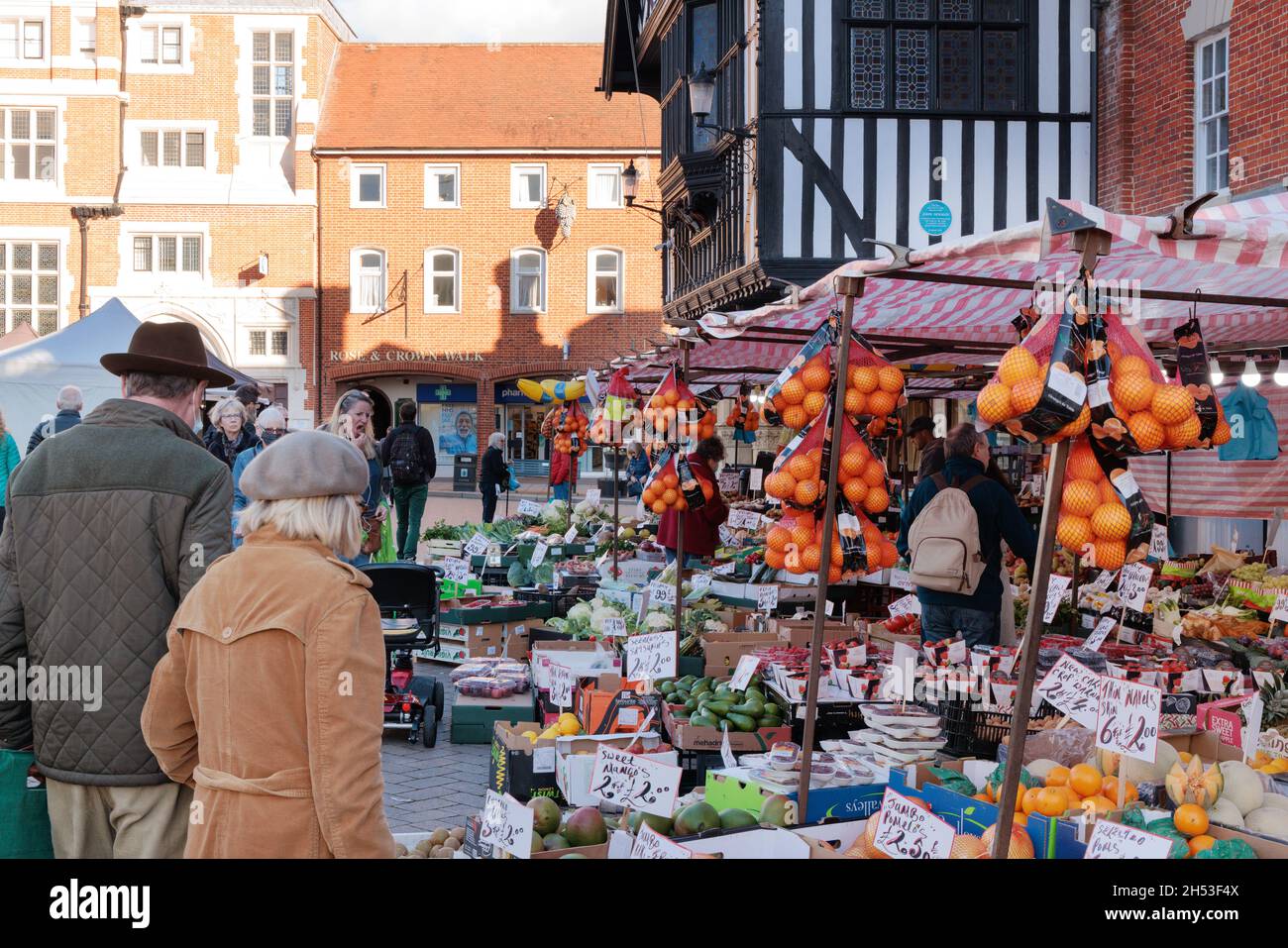 Market stall UK; People shopping at a food market stall, Saffron Walden market, Saffron Walden