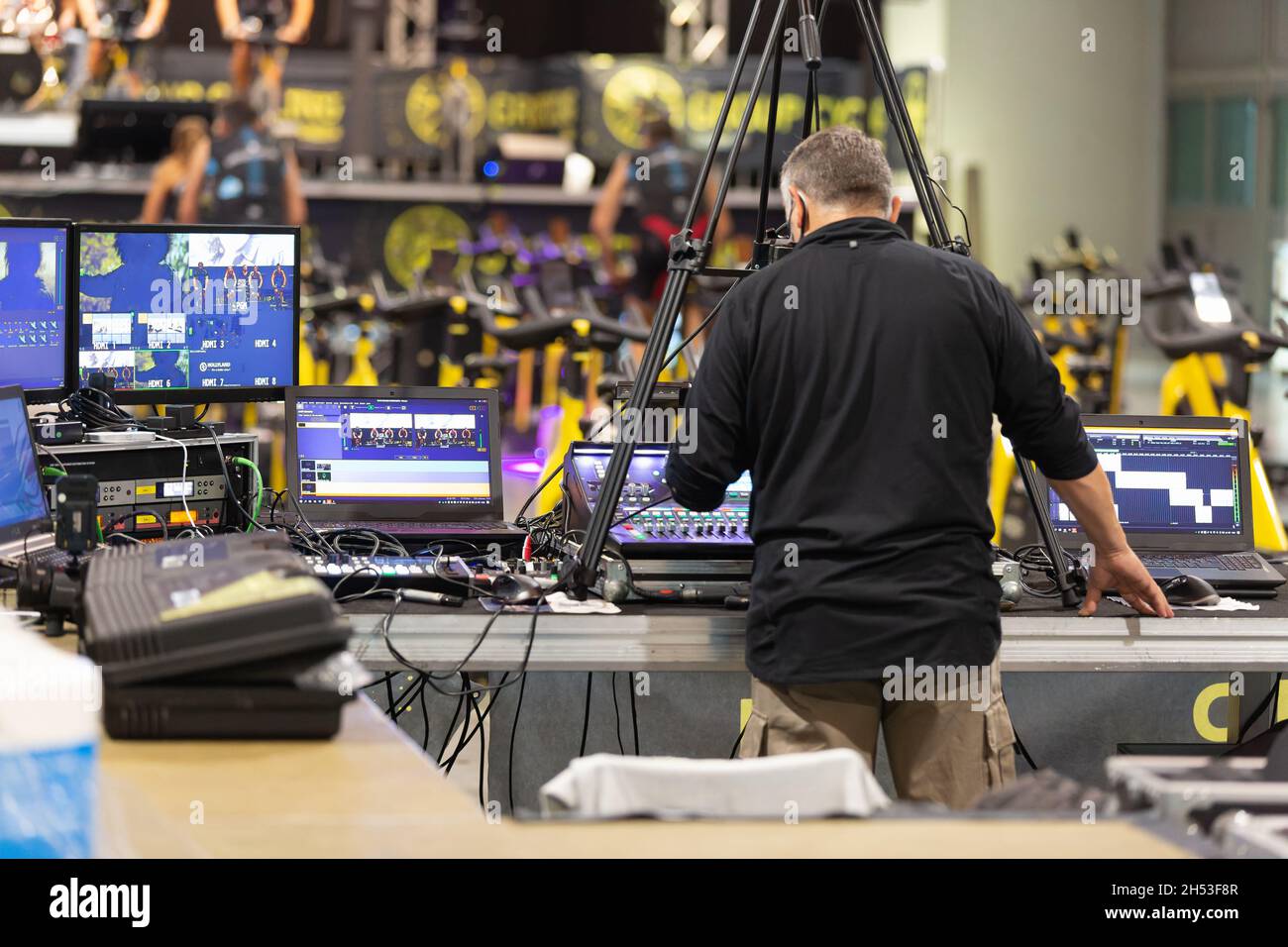 Lighting and Sound Technician and Broadcast Operator at Work in the