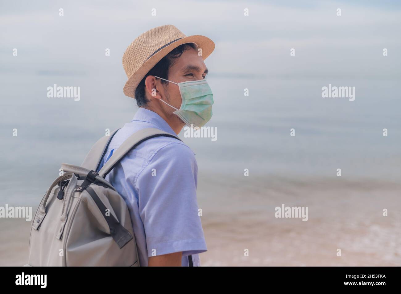 Asian man with bag travel phuket beach Thailand , Phuket sandbox Stock Photo